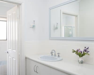 Welcome to Amani House, where every detail is crafted for comfort and inclusivity. Among its three bathrooms, the second one stands out for its wheelchair accessibility, ensuring that all guests can enjoy a relaxing and convenient stay. With wide doorways and a roll-in shower equipped with grab bars, this bathroom is thoughtfully designed to accommodate guests with mobility needs. Luxurious amenities and elegant touches ensure that every visitor experiences the same level of comfort and sophistication throughout their stay at Amani House.